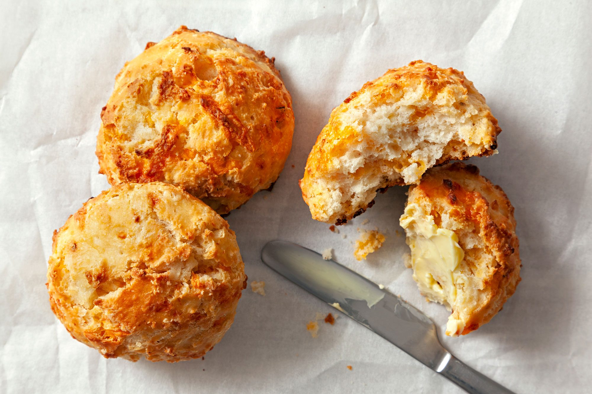 Cheese biscuit sliced by a knife