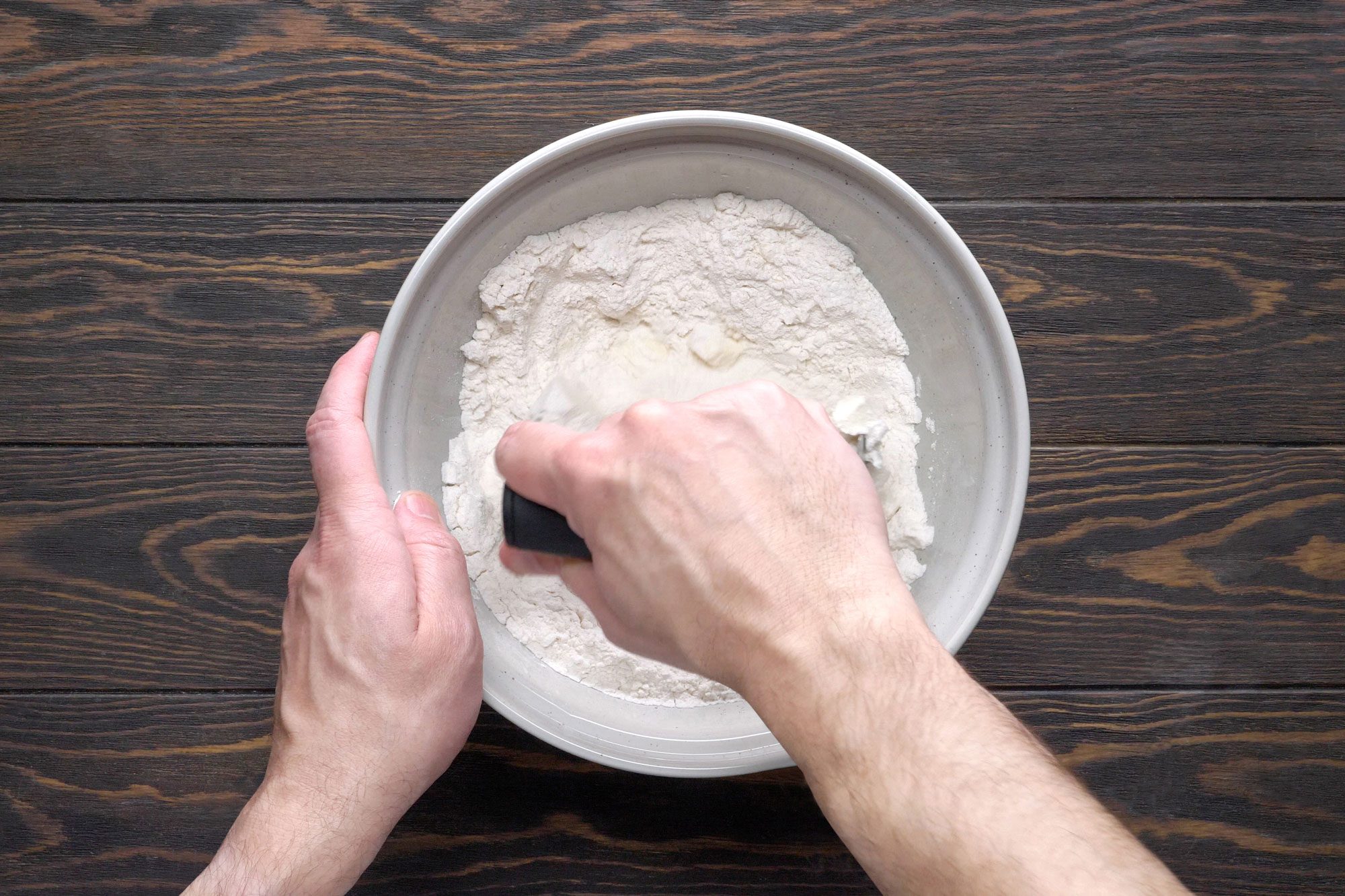 Flour mixing in a large bowl