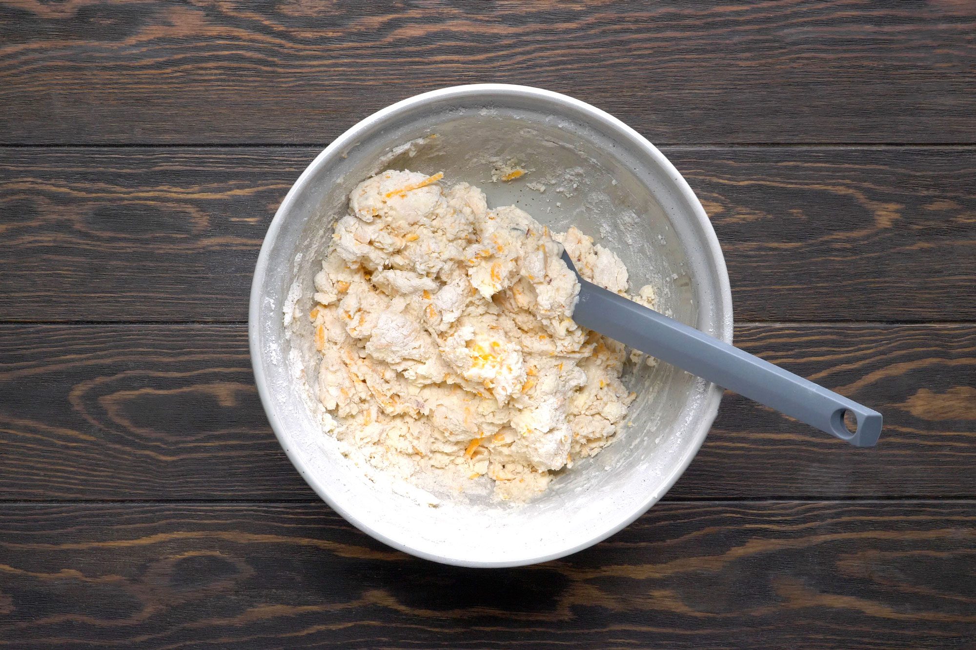 Stir in the cheddar, garlic and pepper flakes