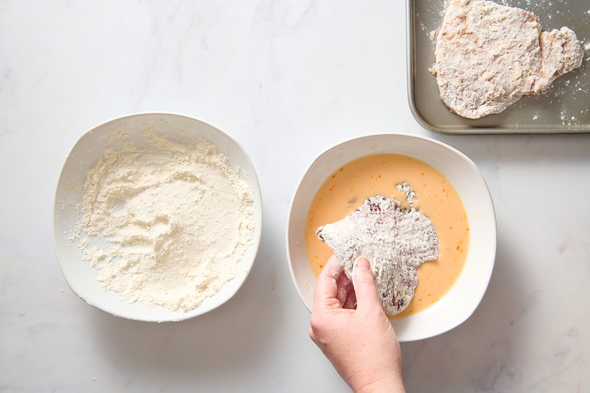 Dredging the steak in the flour and egg mixtures