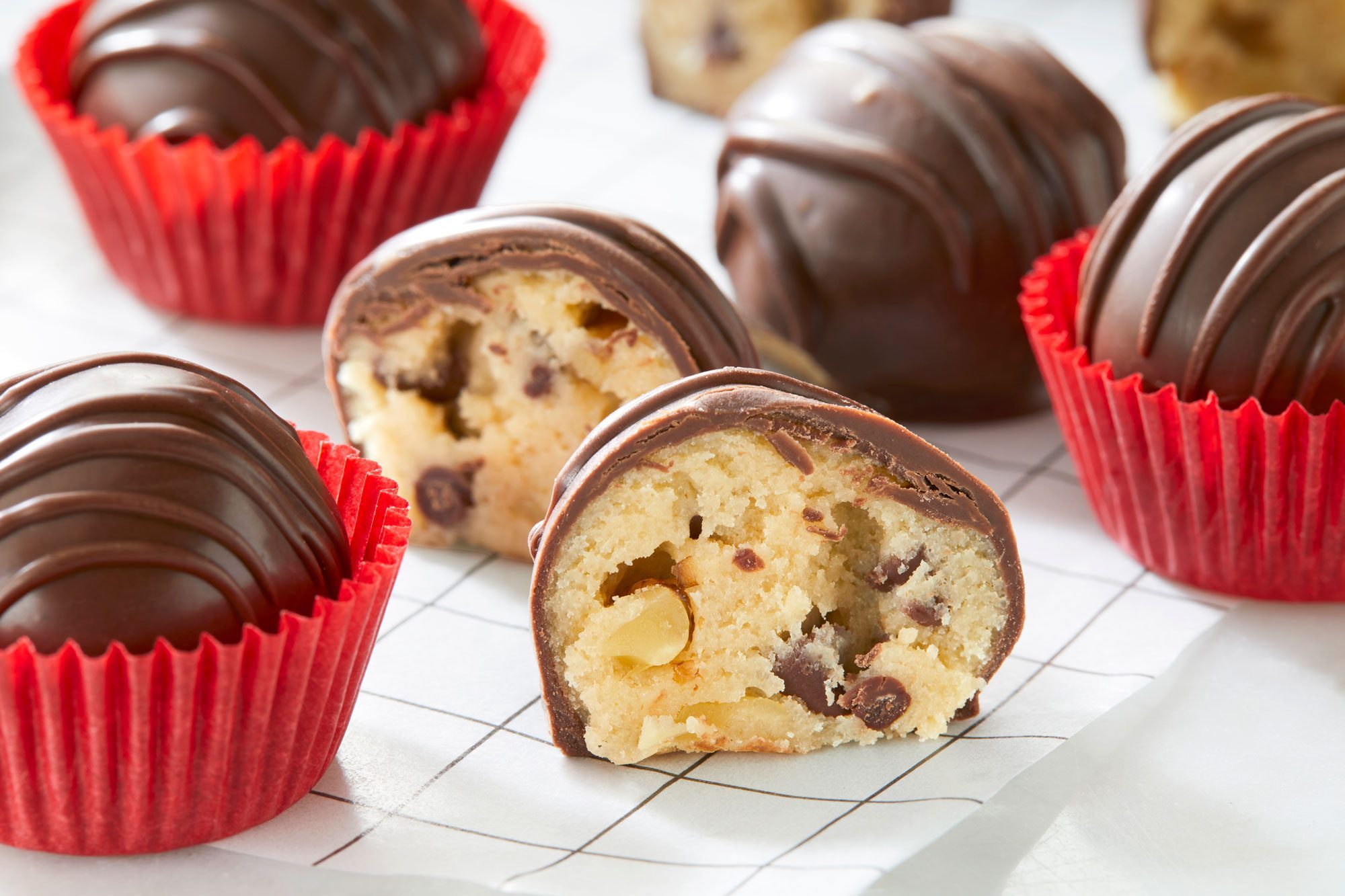 Chocolate-covered Cookie Dough Truffles on a white background