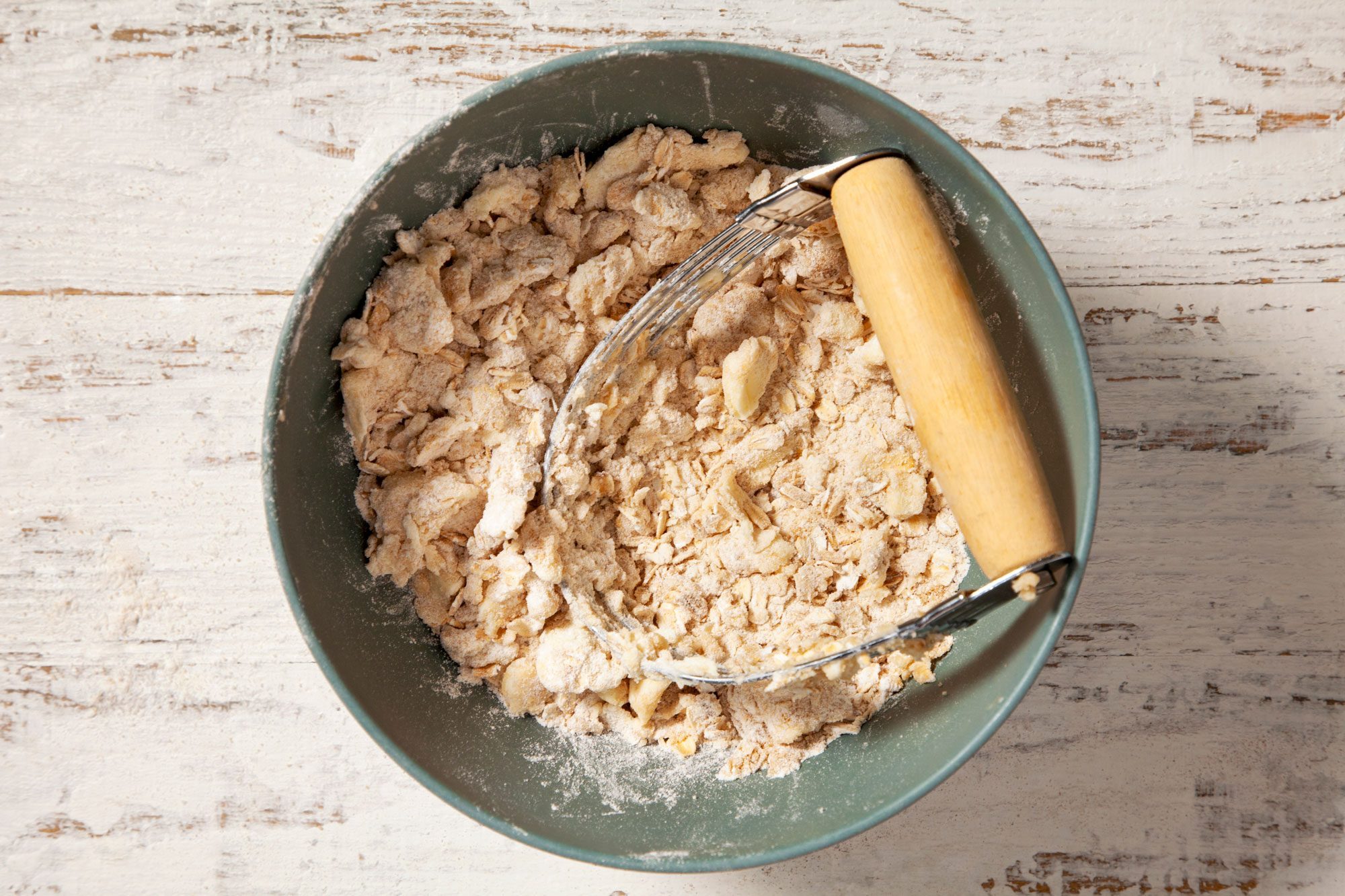 Using pastry blender cut in the butter until crumbly