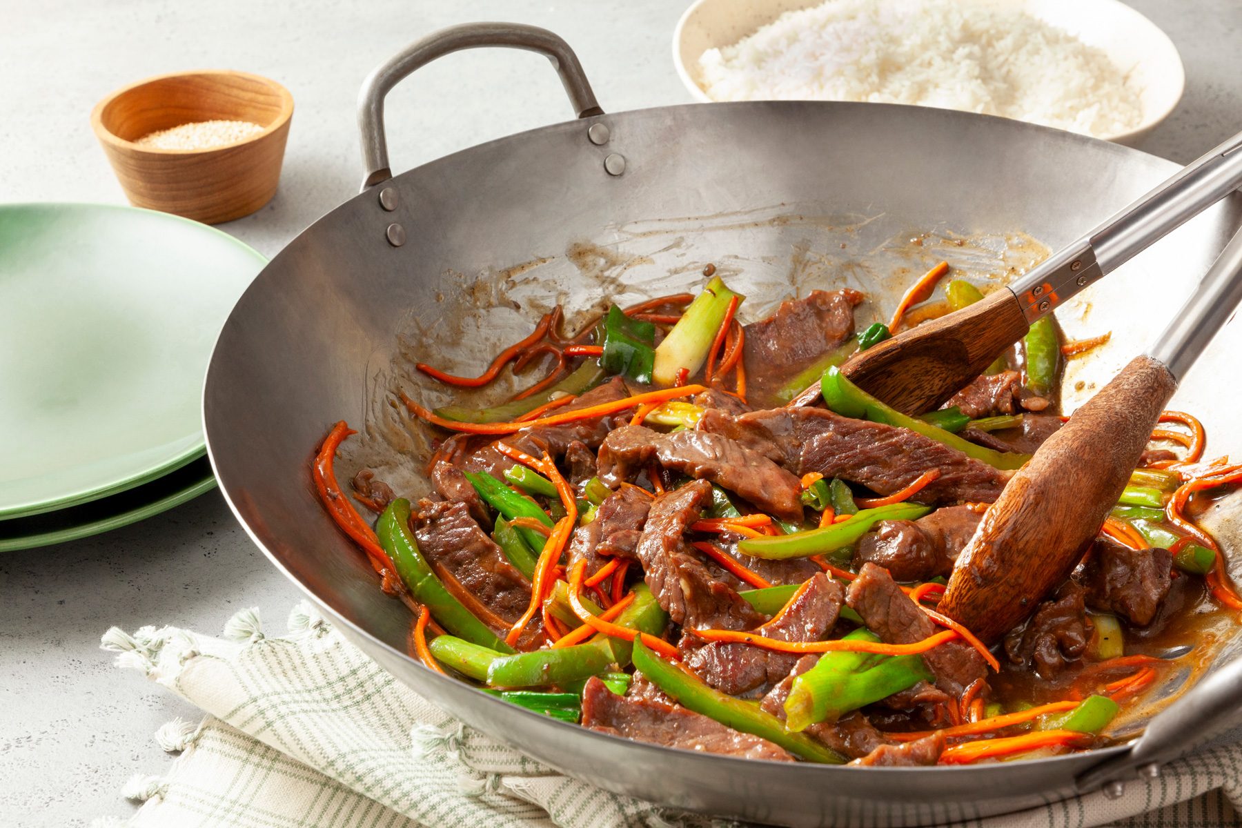 Steak strips with vegetables in a large wok