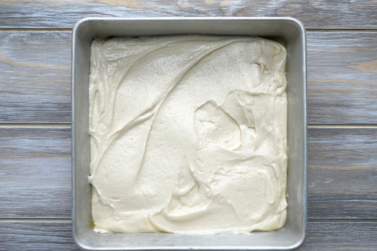 Pour the batter into the pan and spread it evenly to all four corners