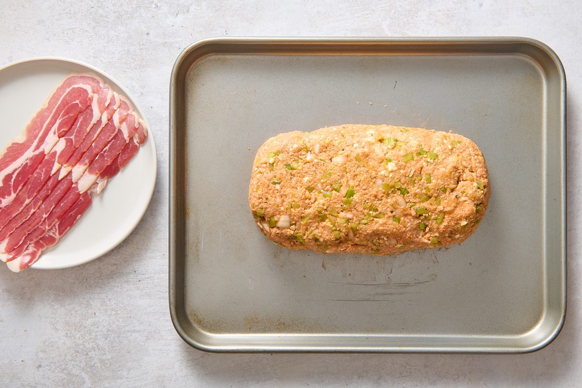 The shaped meatloaf on a baking tray