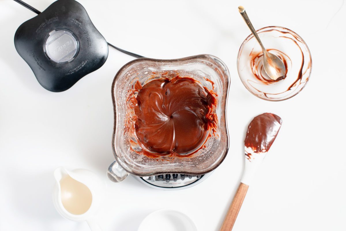 Chocolate Zucchini Cake frosting ingredients mixed in a blender