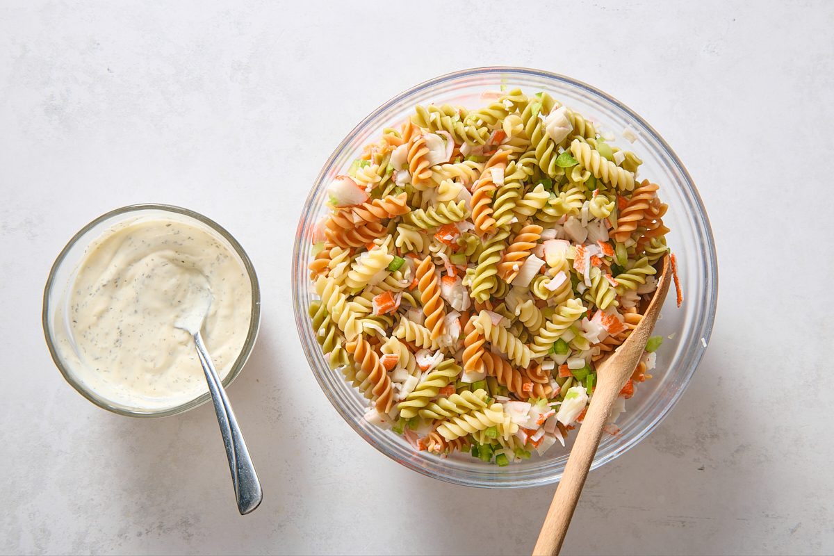 Combining cooked pasta and remaining ingredients 