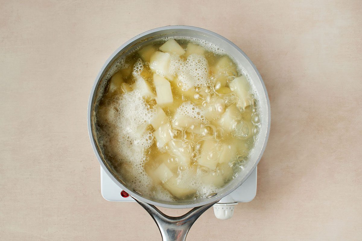 Boil the potatoes.
