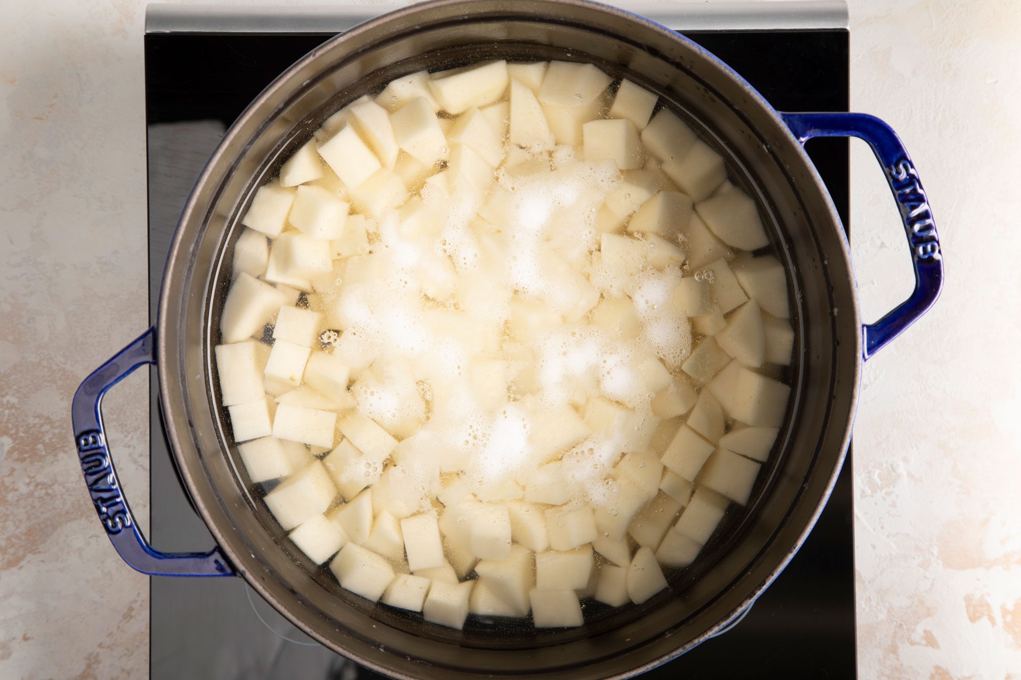 Boil the potatoes in a large saucepan
