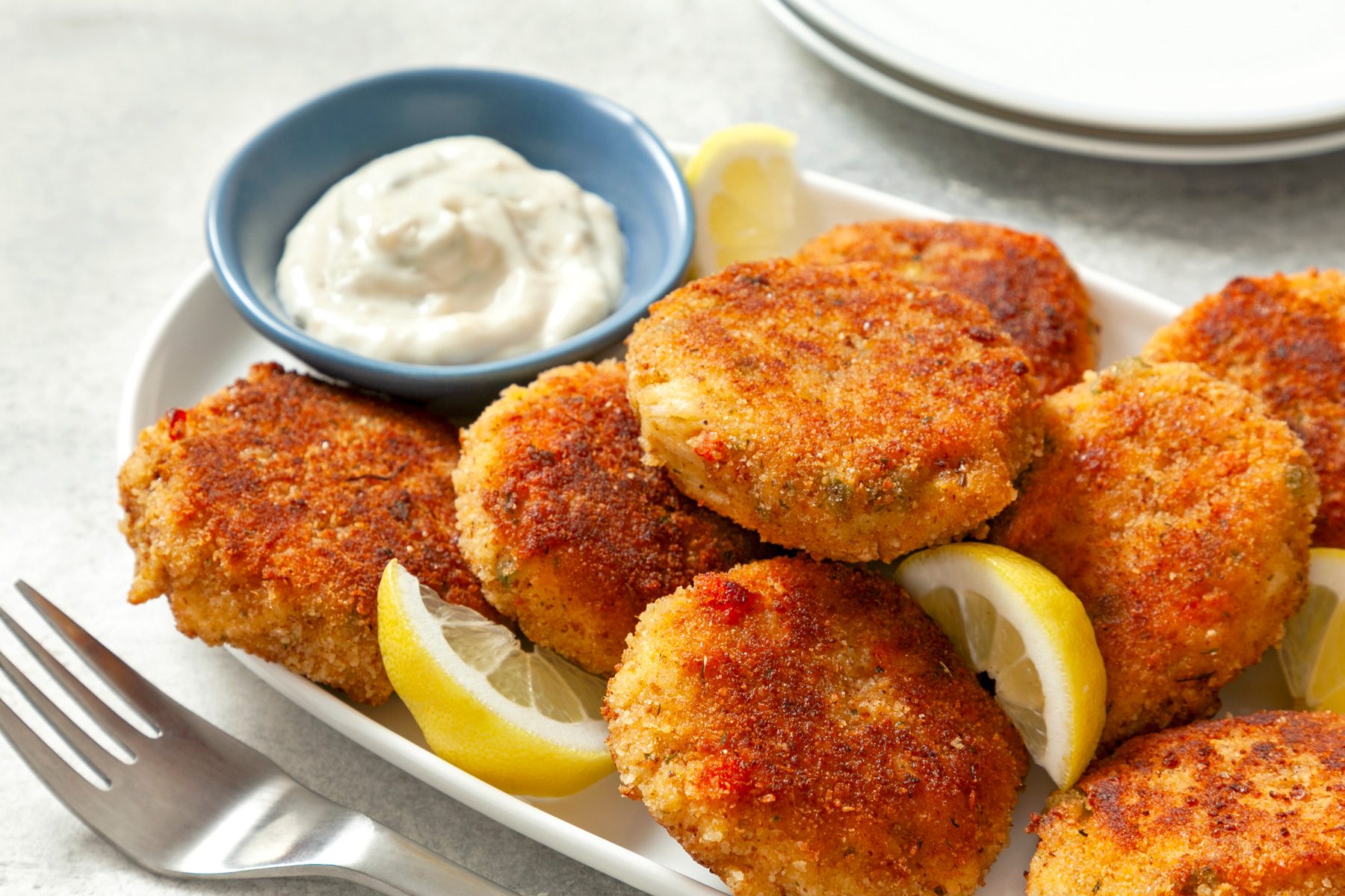A tray of Easy Crab Cakes served with tartar sauce