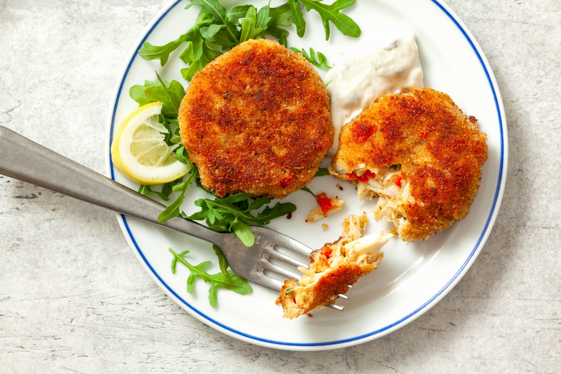 A plate of Easy Crab Cakes served with tartar sauce