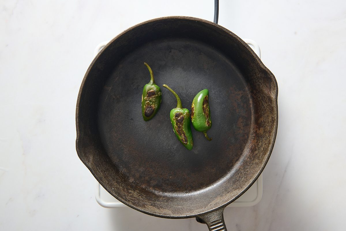 Blistering jalapeños in a skillet