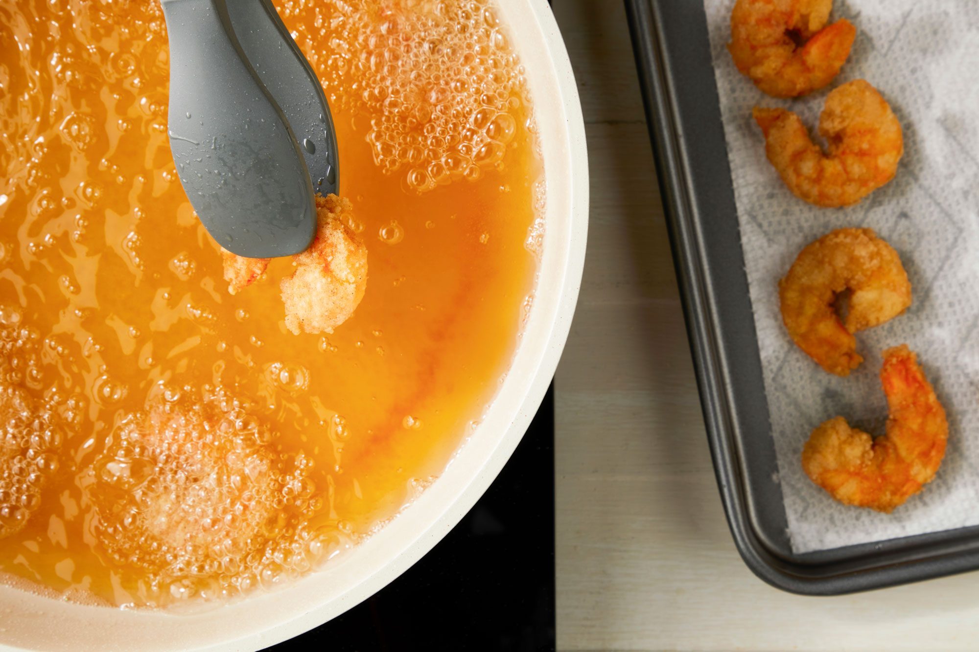 Heat 1/2 in. oil to 375° and fry shrimp in batches until crispy and no longer pink then drain on paper towels