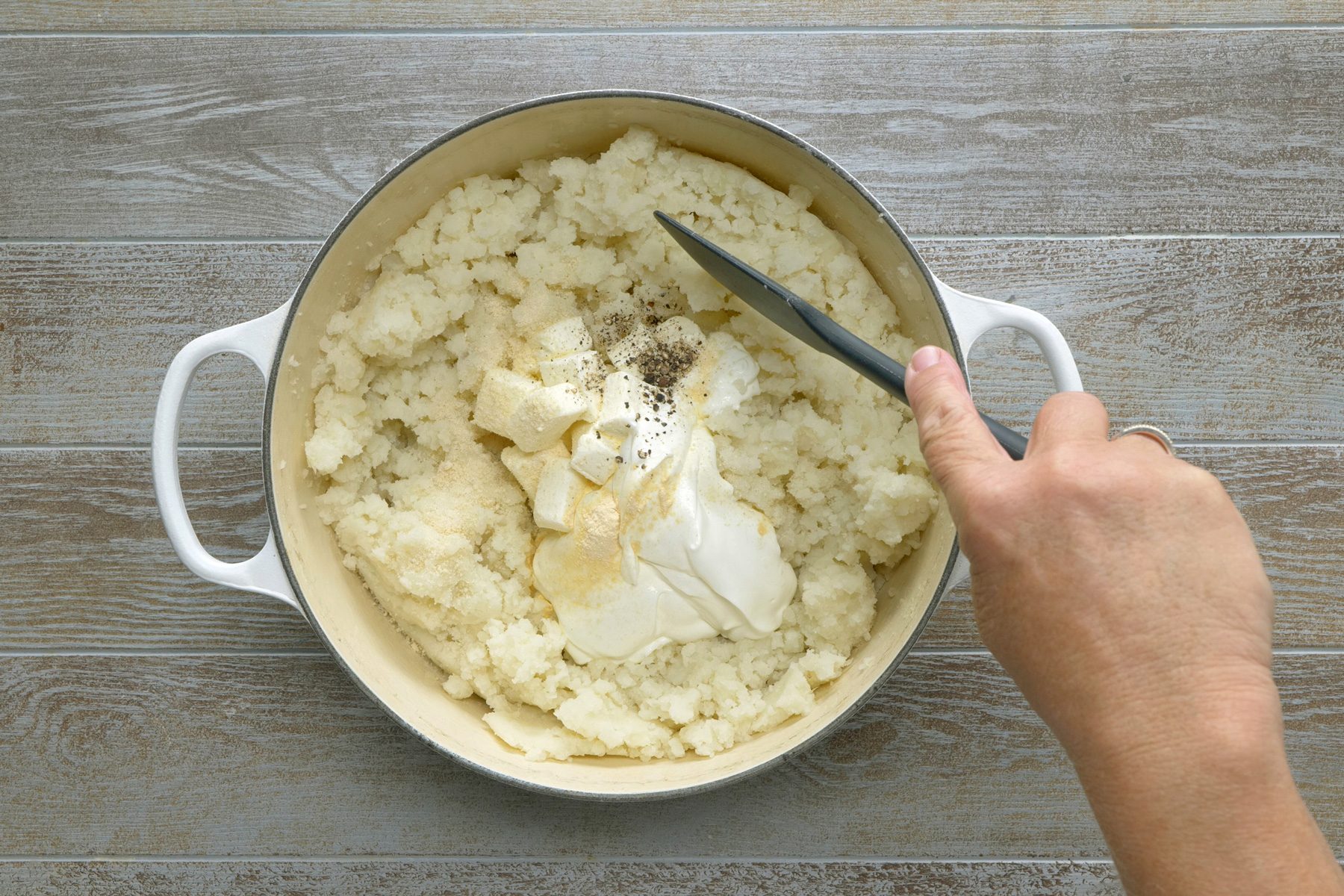 Add cream cheese, sour cream, onion salt, garlic powder and pepper and mix
