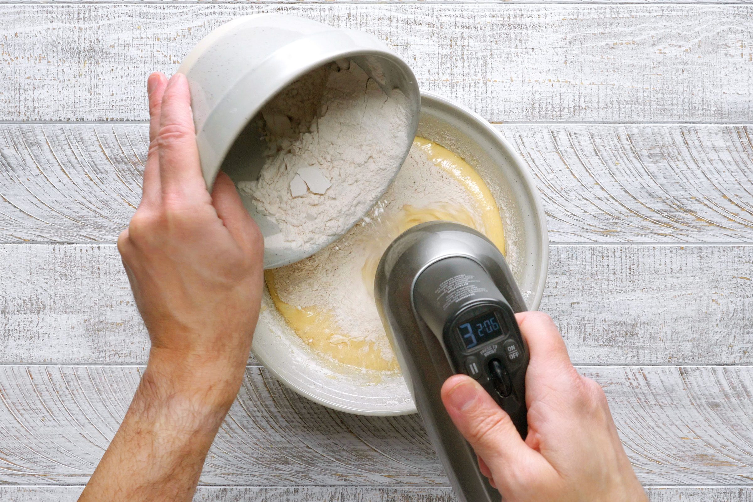 mixing dry and wet ingredients for the apple cake batter