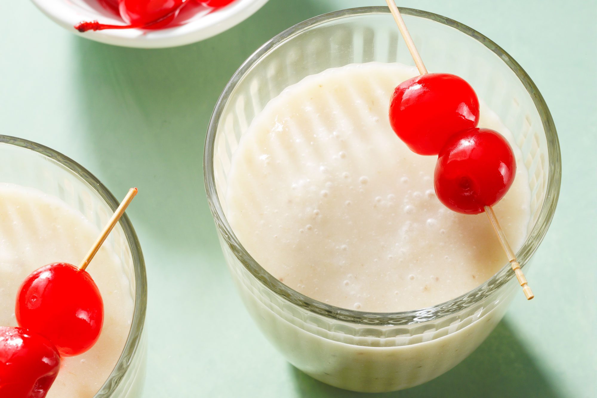 Banana Daiquiri served in chilled glasses garnished with cherry
