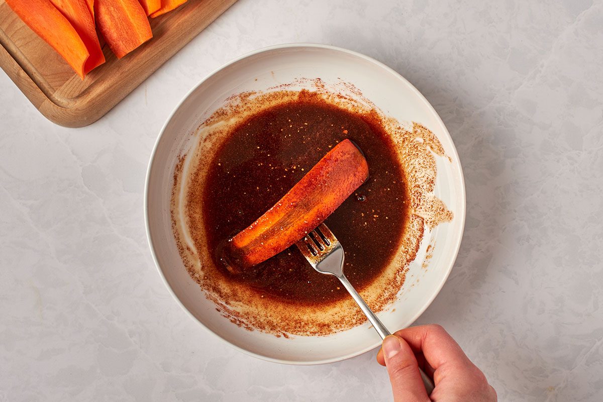 Marinate carrot strips