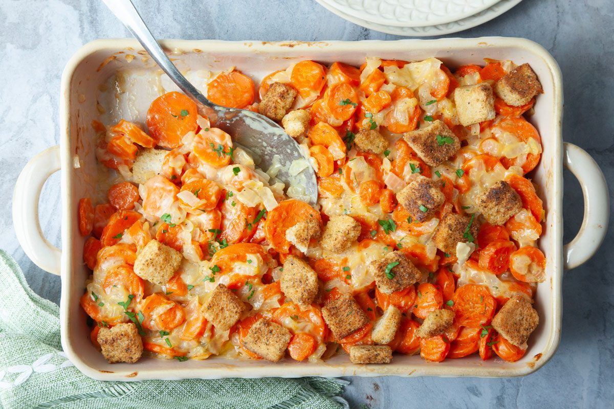 Taste of Home Carrot Casserole overhead angle on blue gray surface