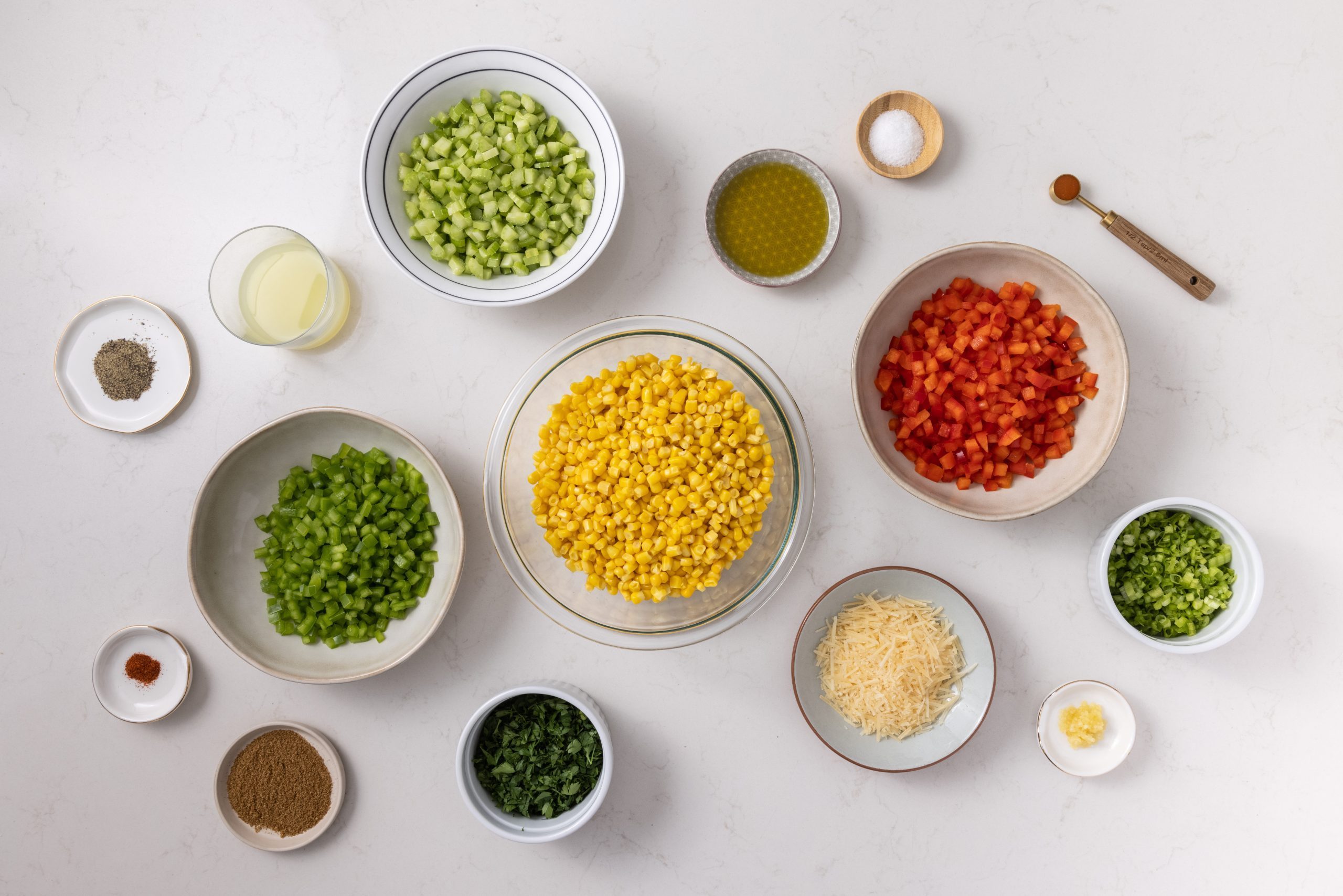 Ingredients for colorful corn salad on kitchen counter