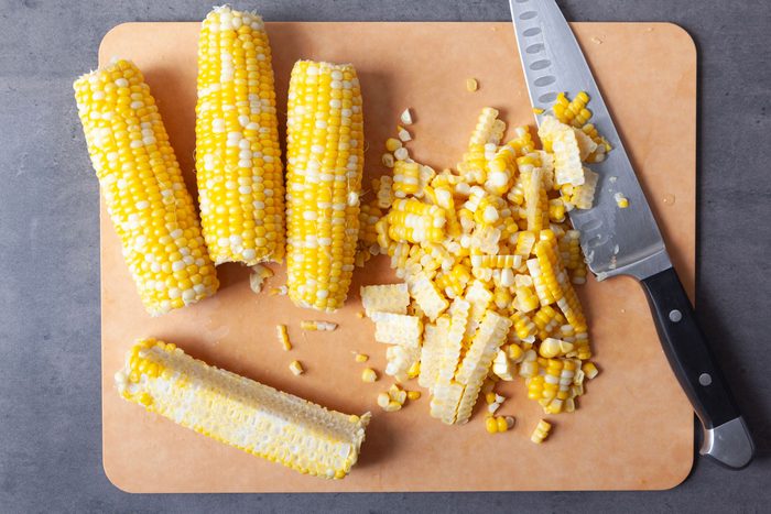 Step 3 of Taste of Home Fresh Corn Salad is to cut all of the corn off of the cobs
