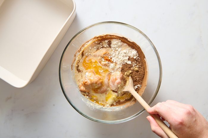 Combining pumpkin base ingredients in a bowl