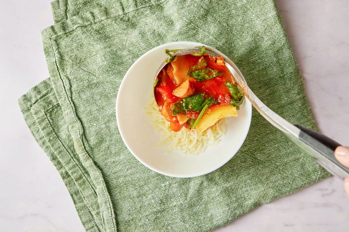 serving slow cooker soup into a bowl