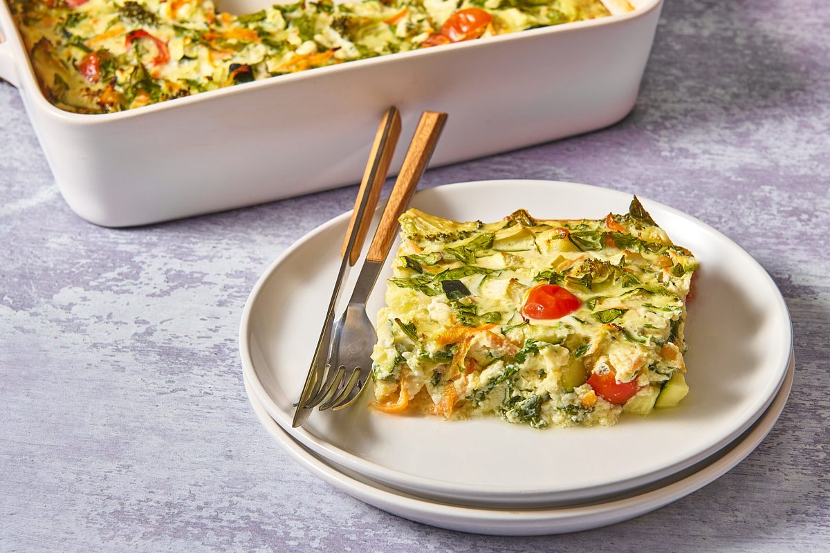 Closeup of a slice of veggie egg casserole on a plate