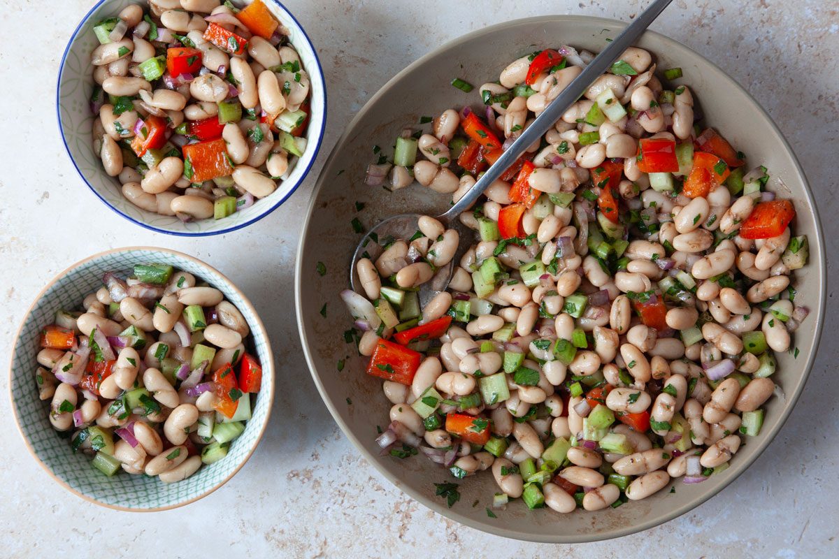 Full yield and two single servings of Taste of Home White Bean Salad, overhead angle
