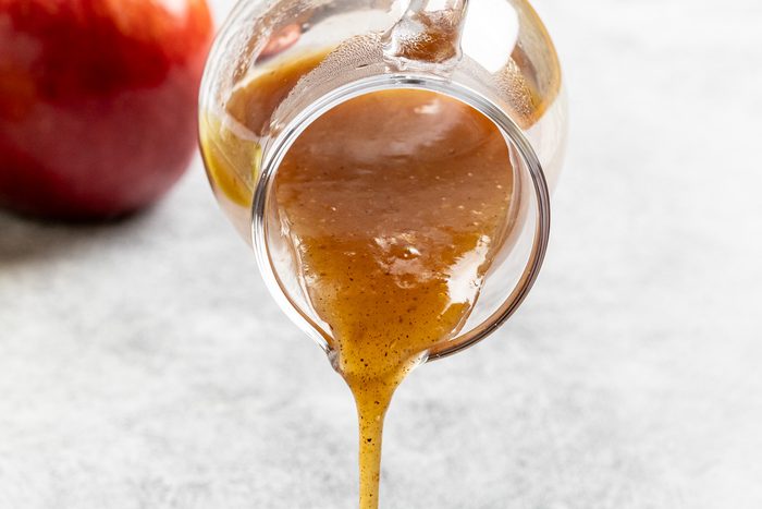 Taste of Home Apple Syrup recipe photo of the syrup being poured.