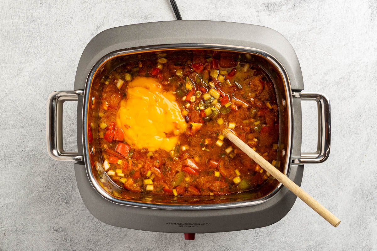 Taste of Home Chicken Fajita Soup recipe photo of the nacho cheese condensed soup added to the slow cooker.