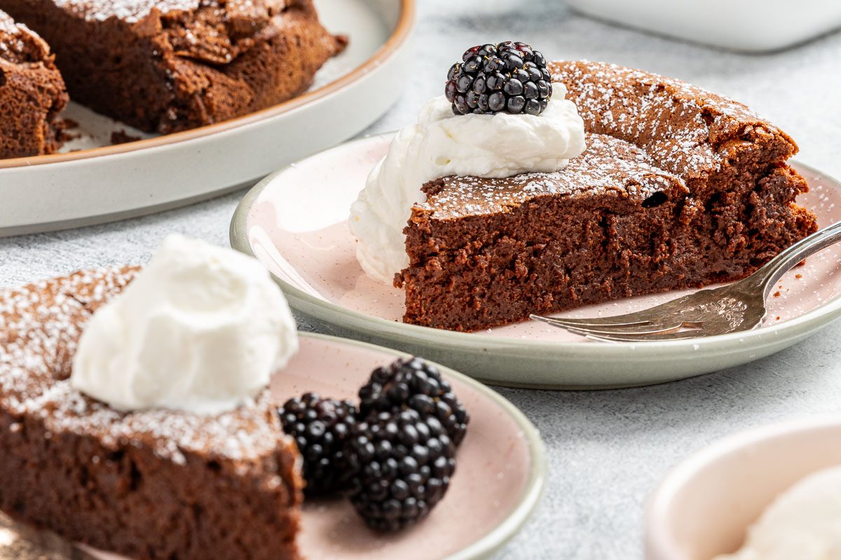 Taste of Home Chocolate Olive Oil Cake recipe photo of the finished recipe cut into slices and served on plates.