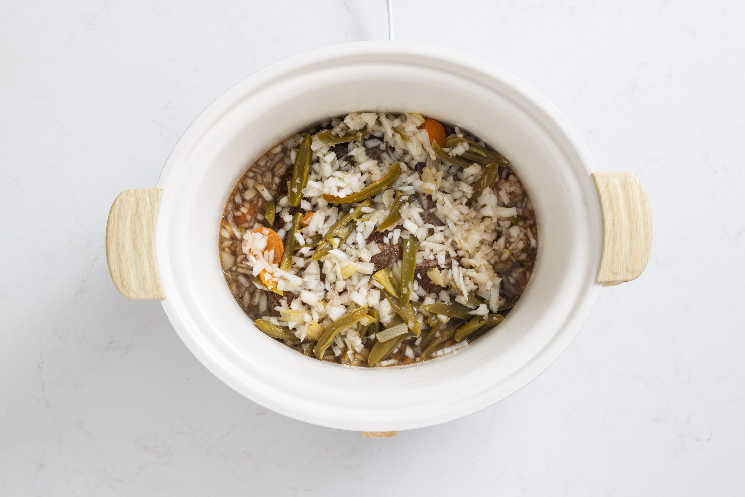 Chuck roast in slow cooker with veggies.