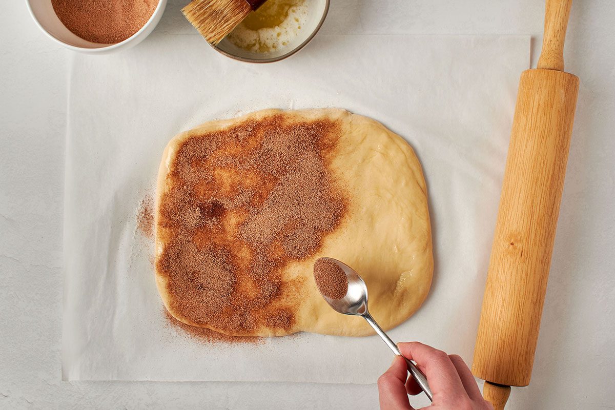 Sprinkle cinnamon sugar over dough