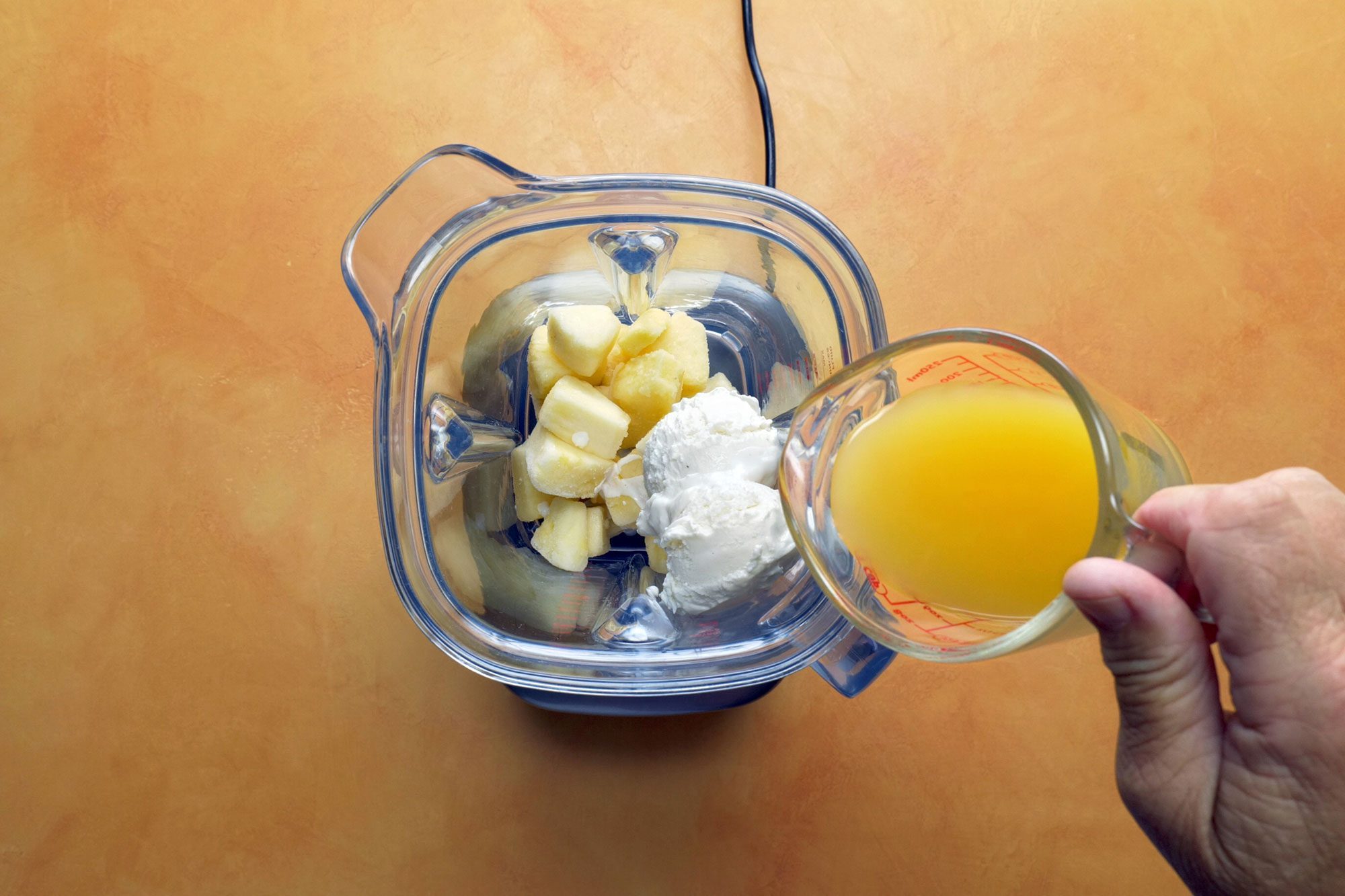 Place all ingredients in a blender then cover and process until thick