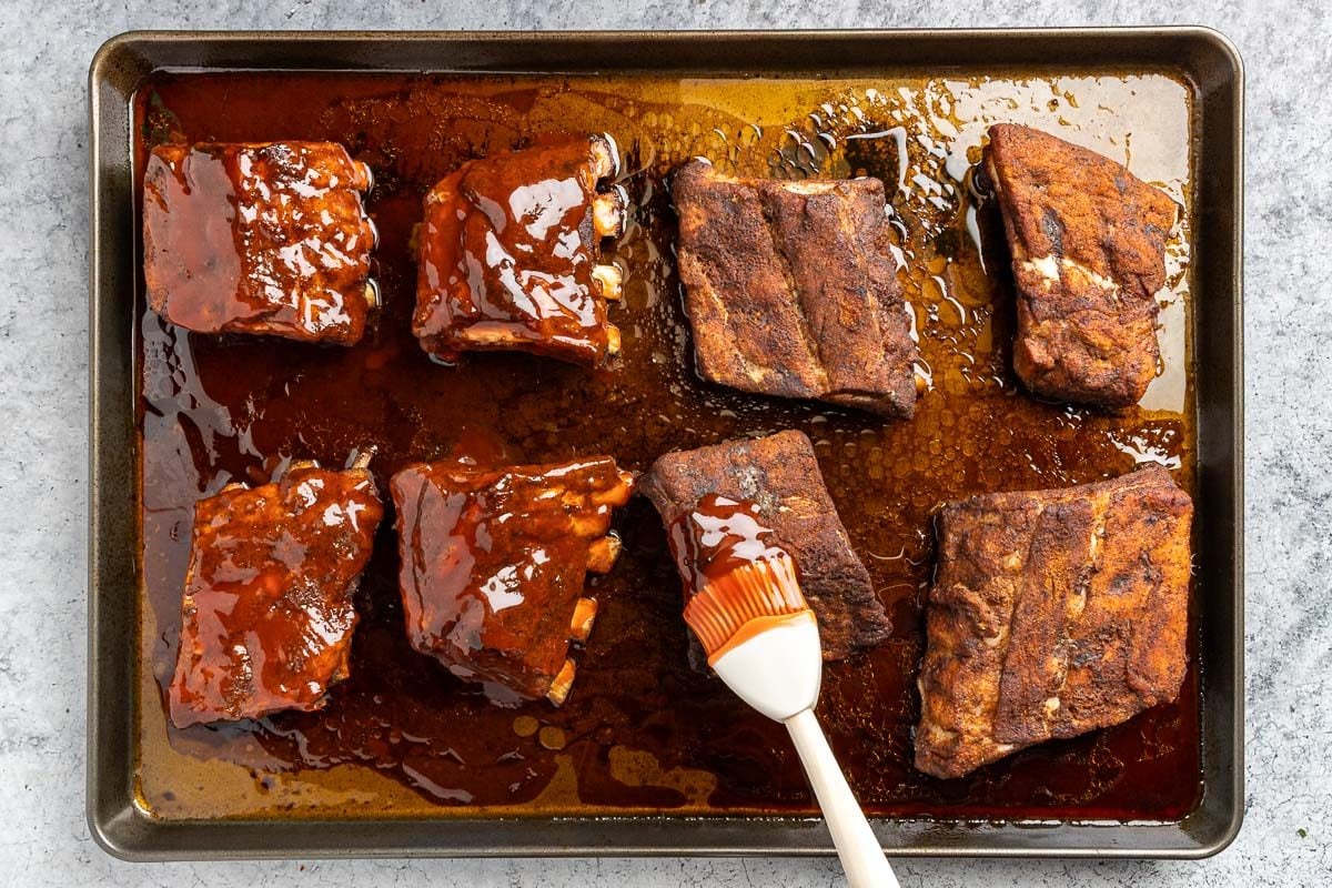 Taste of Home Dr Pepper ribs recipe photo of the sauce applied to the baked ribs.