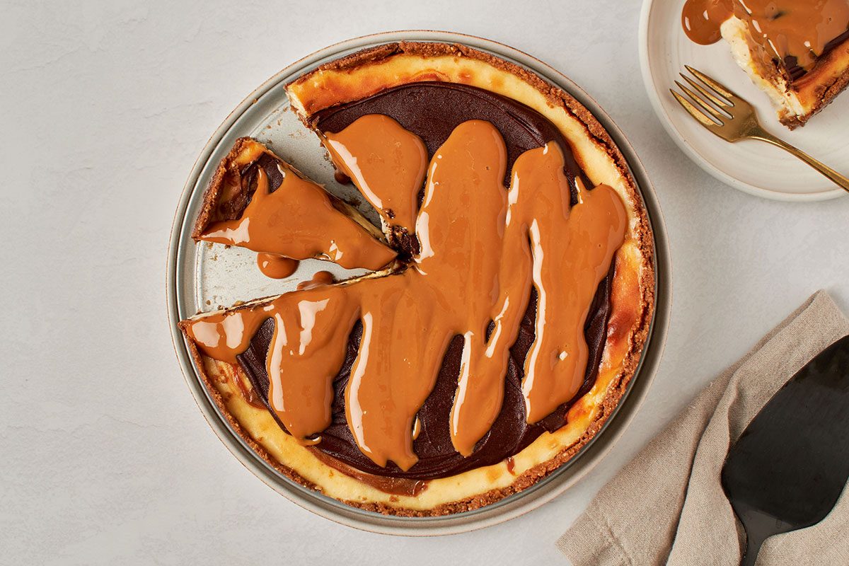 This decadent dulce de leche cheesecake by Taste of Home features rich cream cheese filling with swirls of dulce de leche.