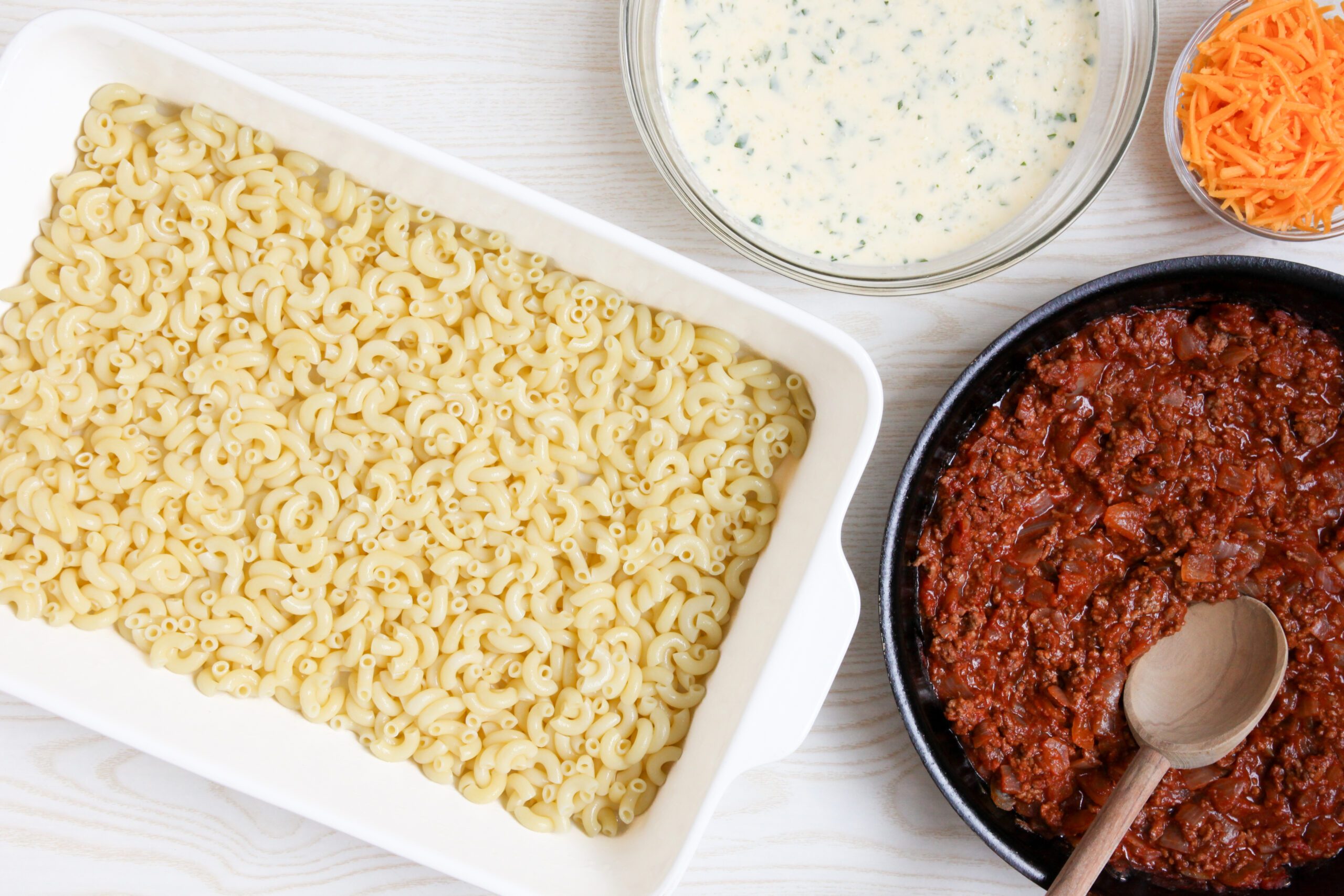 Assembling hamburger macaroni casserole