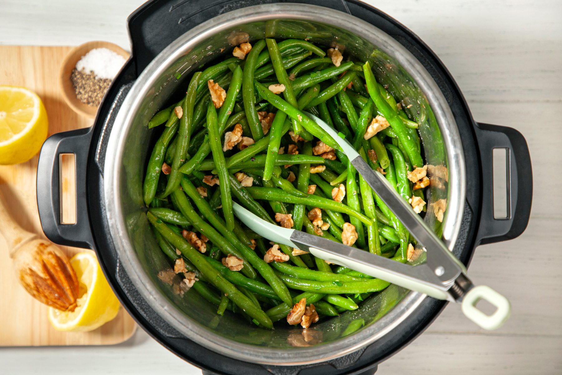Top view shot of all ingredients mixed with cooked green beans 