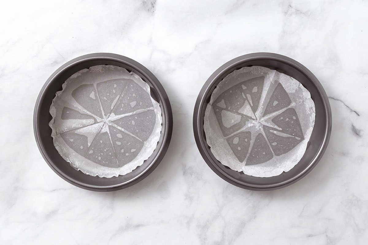 Step 1 Of Greased Round Baking Pans For Lemon Cake Recipe For Taste Of Home