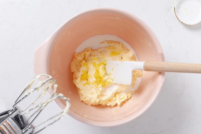 Mixing bowl with cookie batter being prepared.