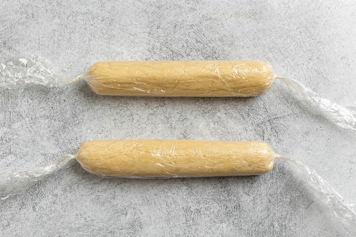 Taste of Home Lemon Meltaway Cookies recipe photo the cookie dough plastic wrapped in into two 8 inch rolls.