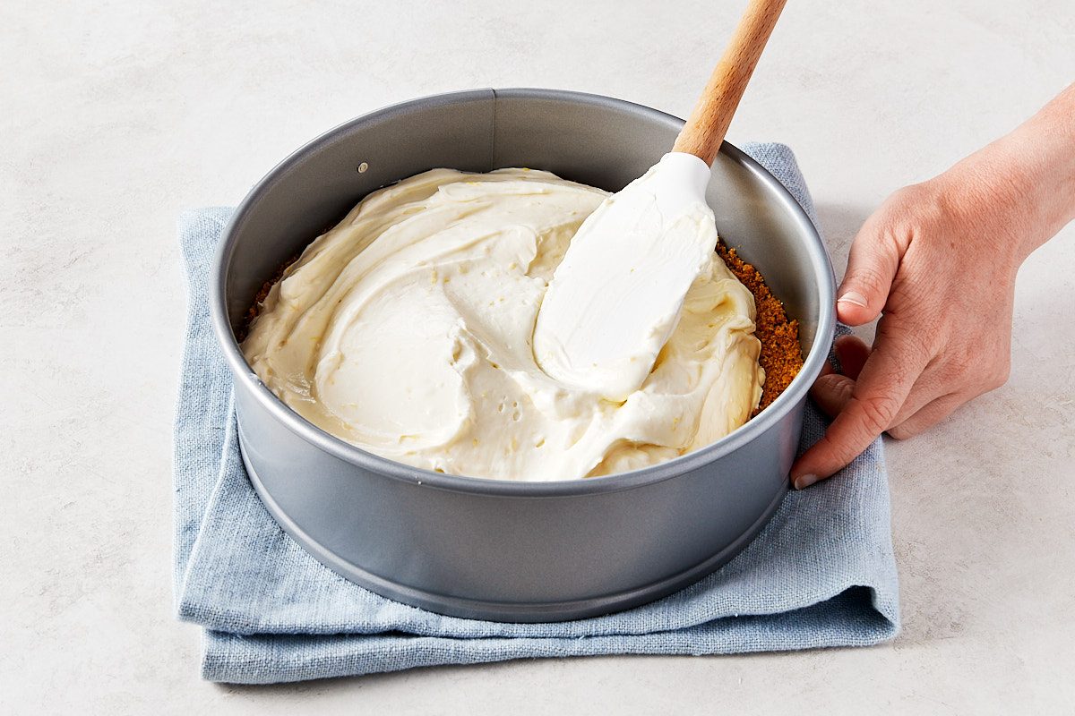 No Bake Lemon Cheesecake Step 4- spreading prepared filling into graham cracker crust