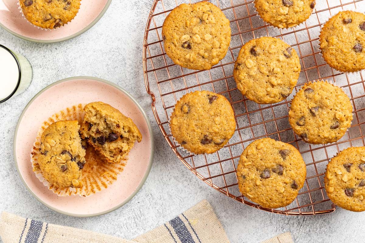 Taste of Home Oatmeal Chocolate Chip Muffins recipe photo of the finished recipe served on plates and a cooling rack.