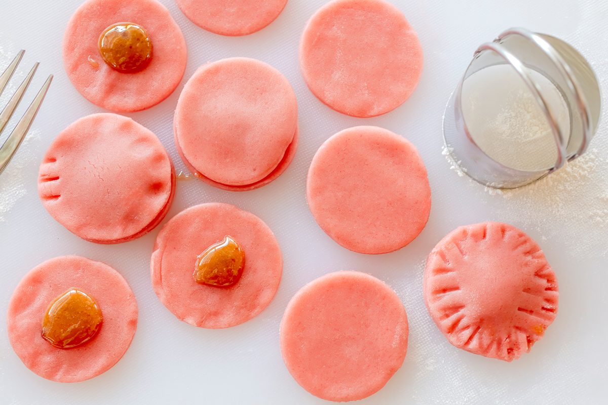 Pretty pink, jelly filled, strawberry sandwich cookies with step-by-step instructions from Taste of Home.
