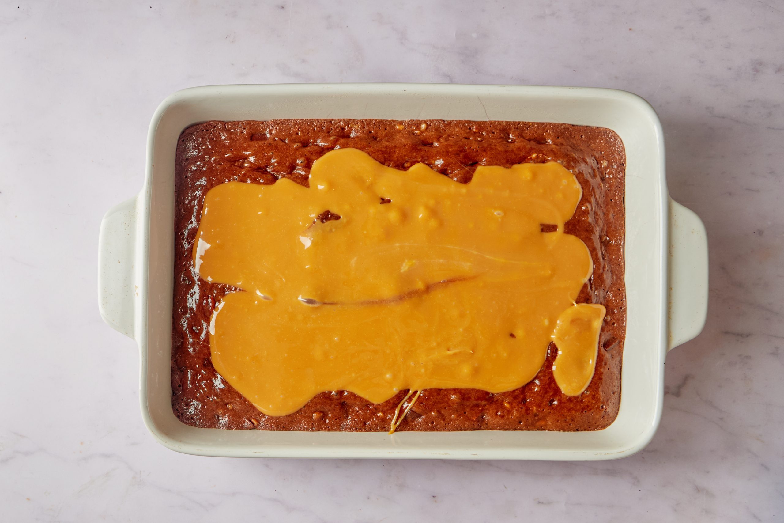 Add the caramel to the semi baked layer.