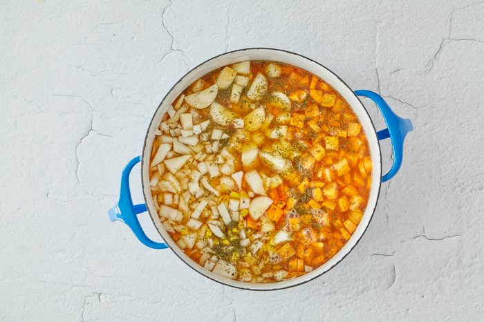 Cook the vegetables for chicken and biscuits.