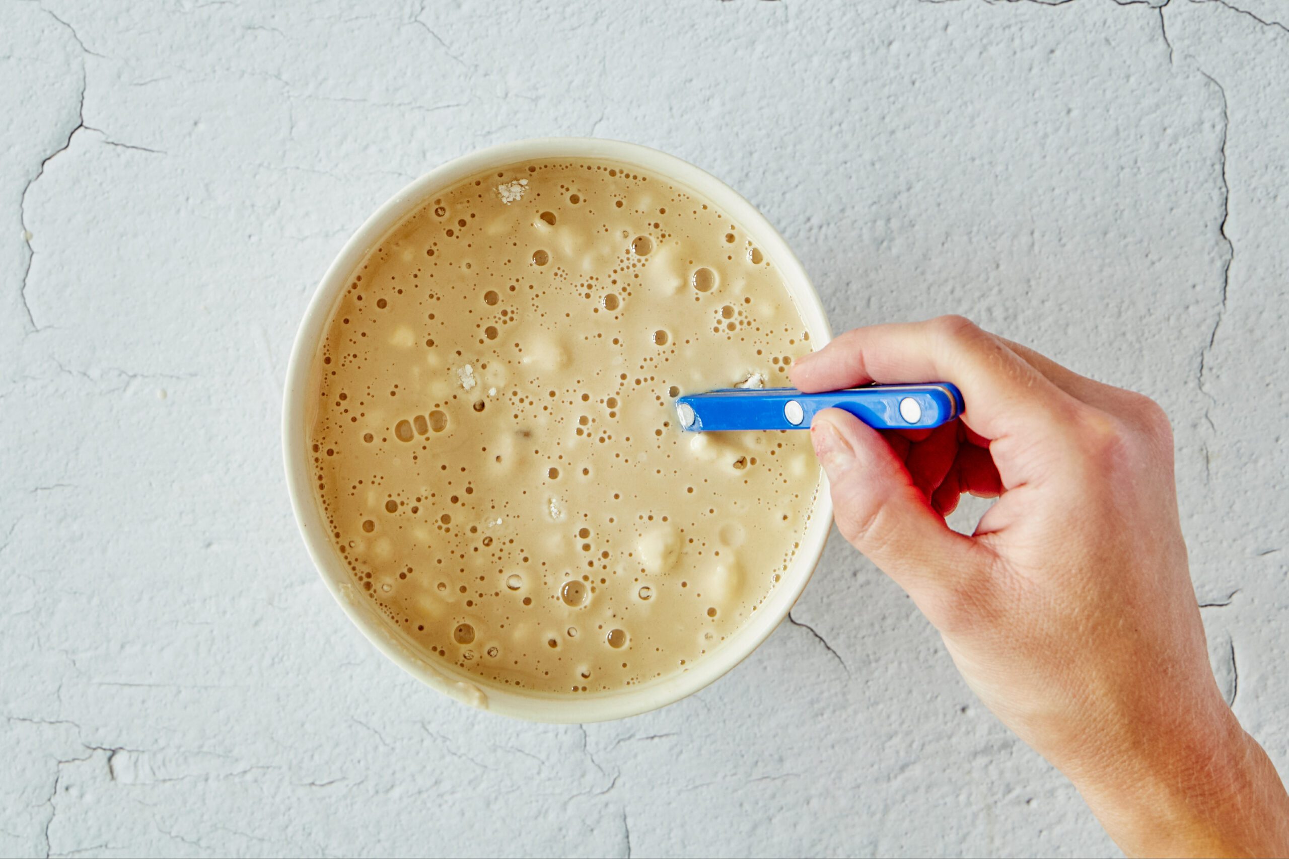 Make the flour mixture for chicken and biscuits.