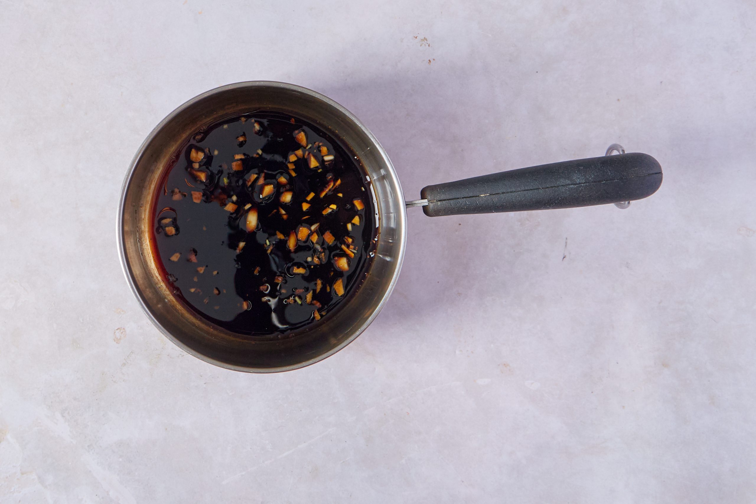 Reduce the marinade for teriyaki steak.