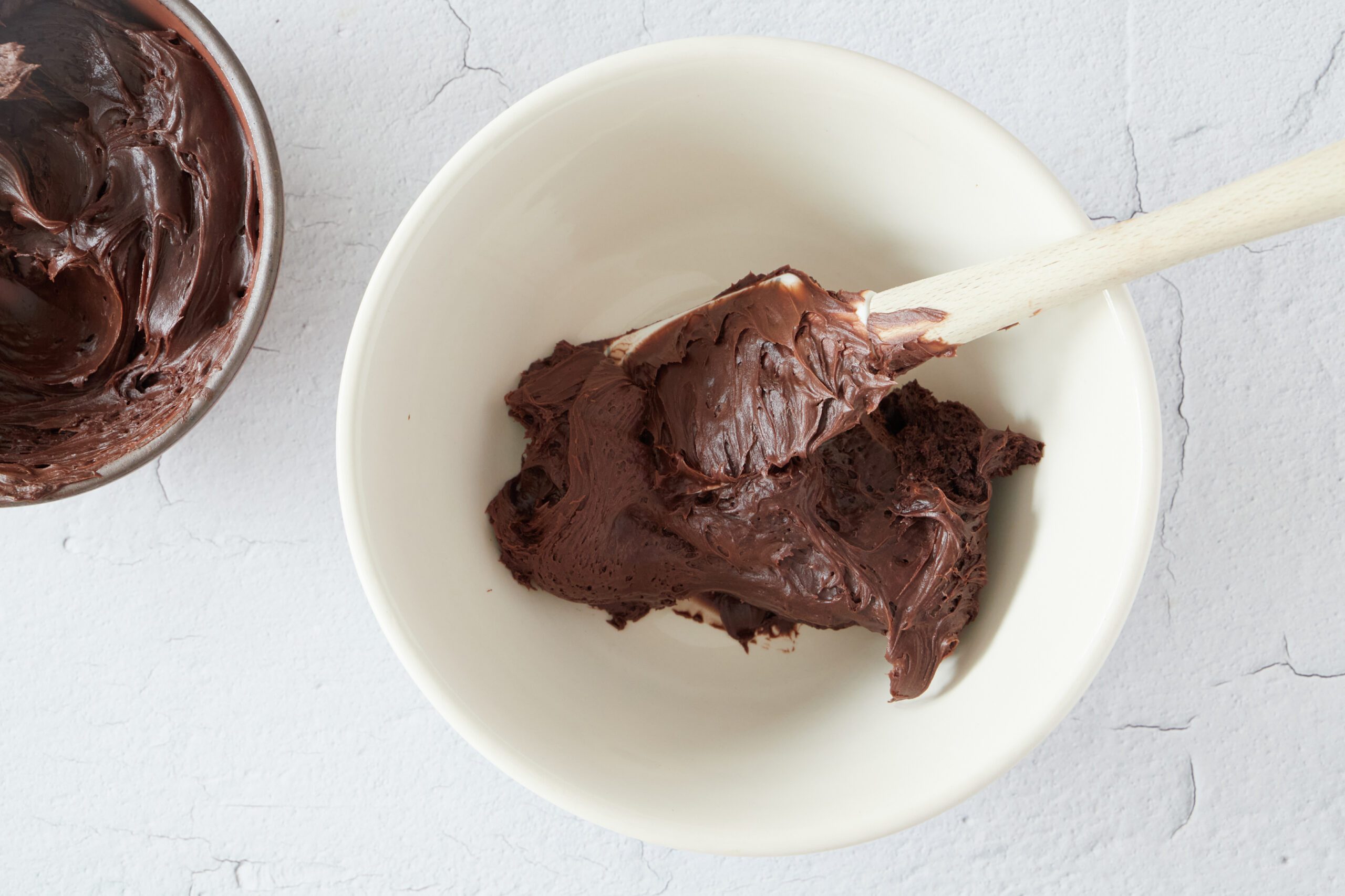 Prepare the frosting for chocolate peanut butter cookies.