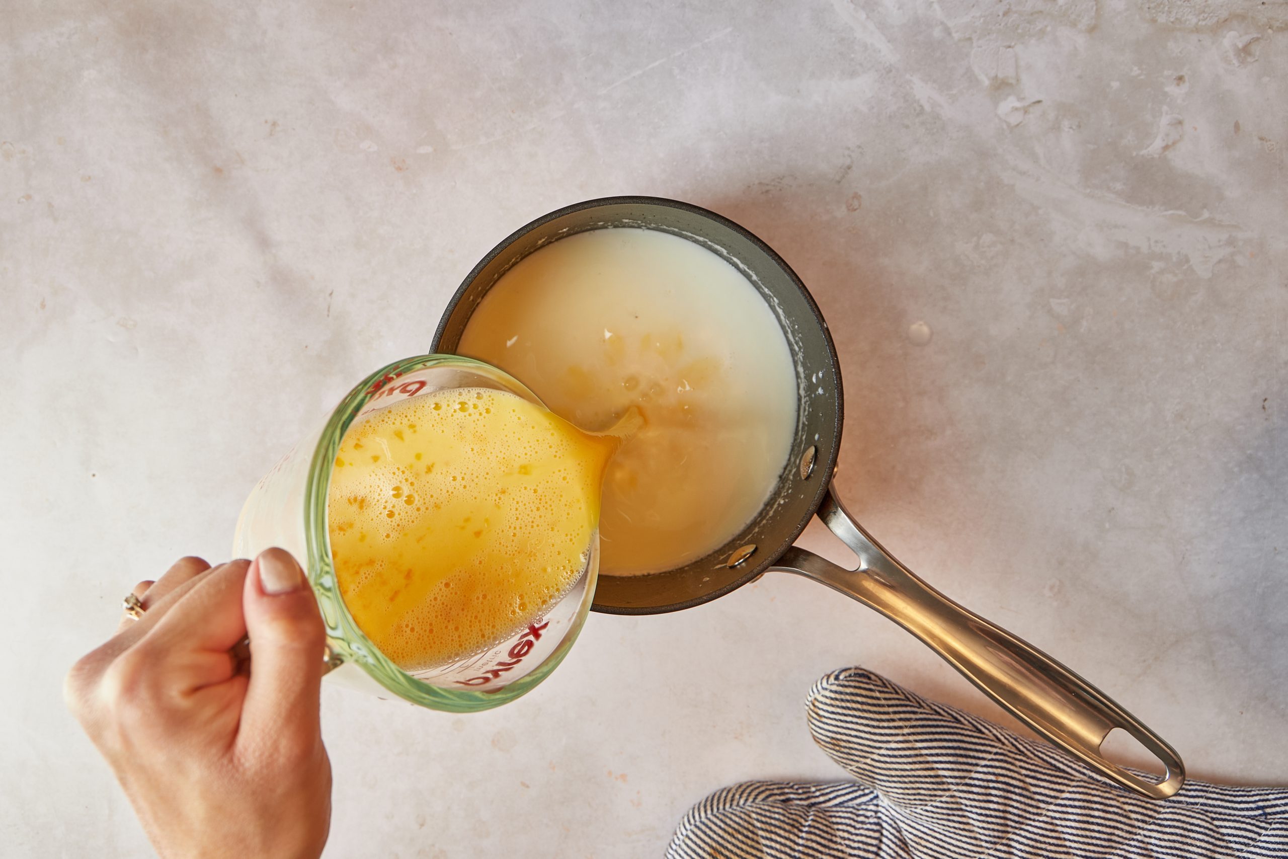 Make the custard base for the praline ice cream.